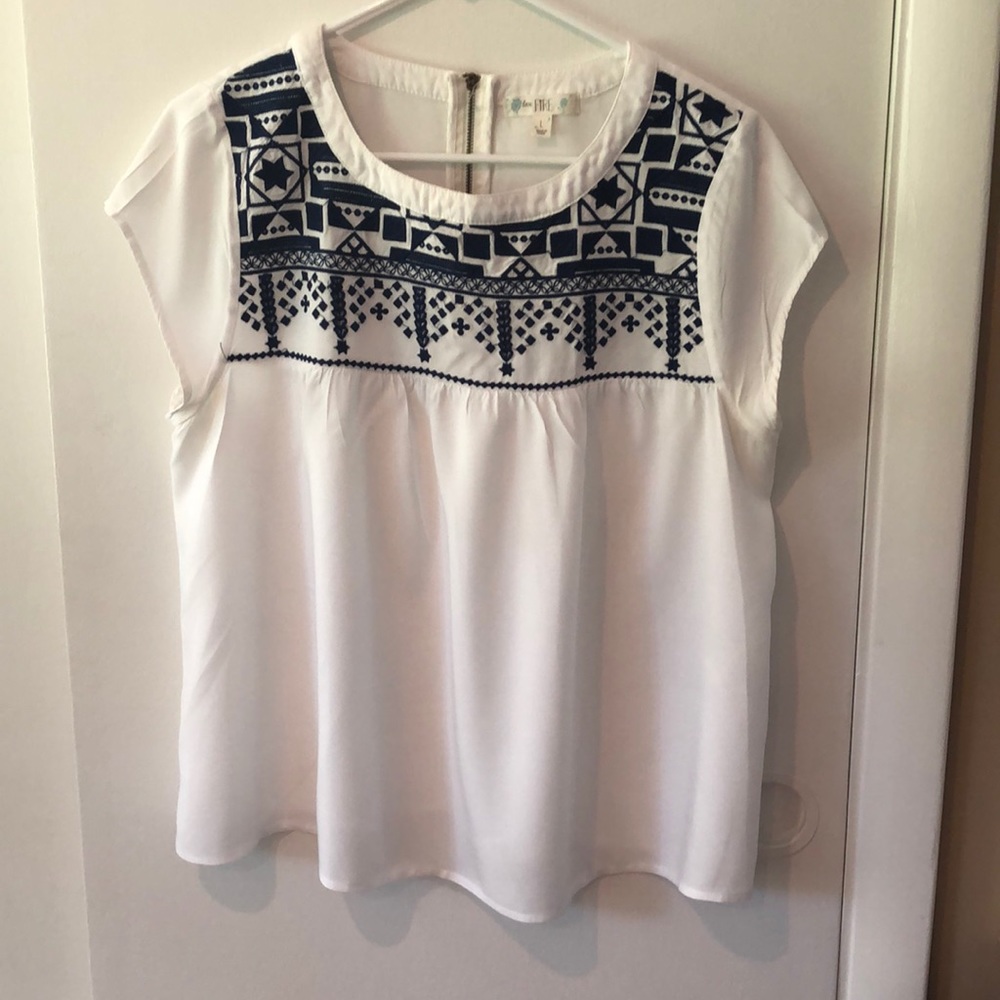 White and navy top